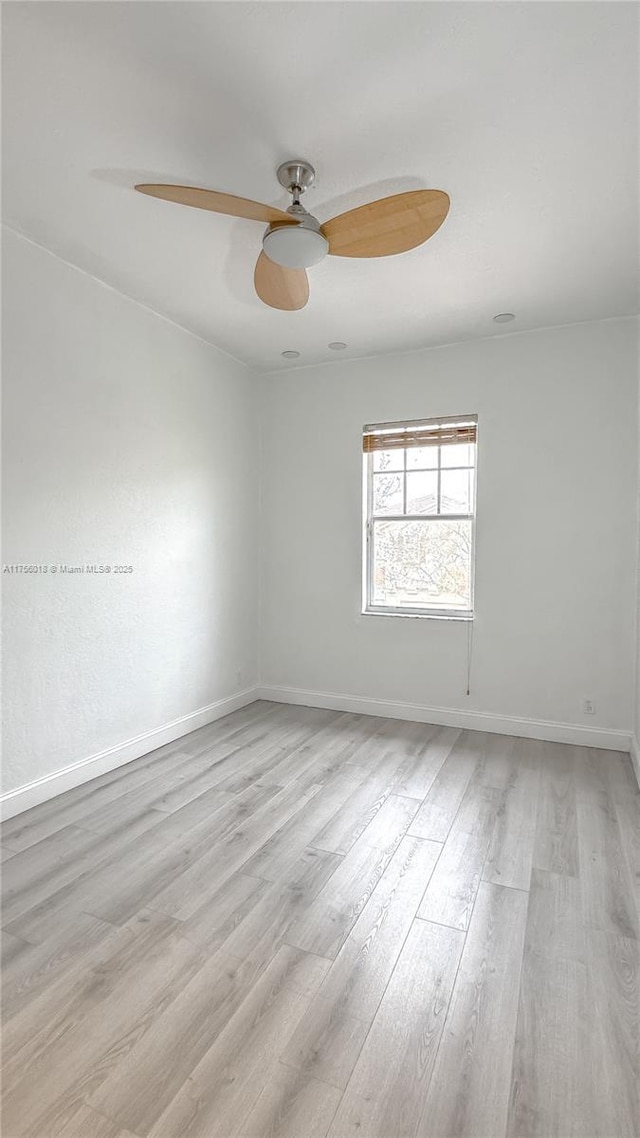 5737 NW 119th Dr Unit 5737, Coral Springs, FL 33076 - empty room featuring ceiling fan, light wood-type flooring, and baseboards