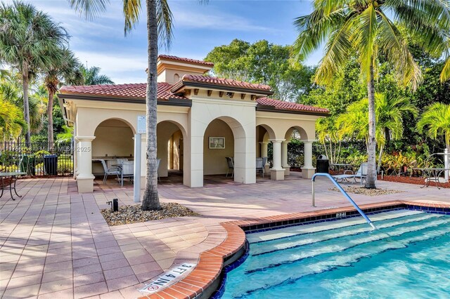 5737 NW 119th Dr Unit 5737, Coral Springs, FL 33076 - view of pool with a patio area, a pool, and fence