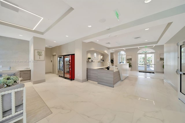 5737 NW 119th Dr Unit 5737, Coral Springs, FL 33076 - interior space with visible vents, recessed lighting, french doors, a raised ceiling, and marble finish floor