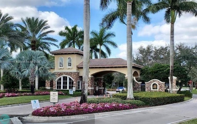 5737 NW 119th Dr Unit 5737, Coral Springs, FL 33076 - view of property featuring driveway