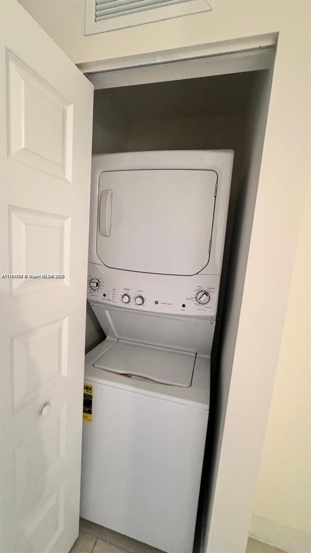 8045 NW 104th Ave Unit 35, Doral, FL 33178 - laundry area featuring estacked washer and dryer and light tile patterned floors