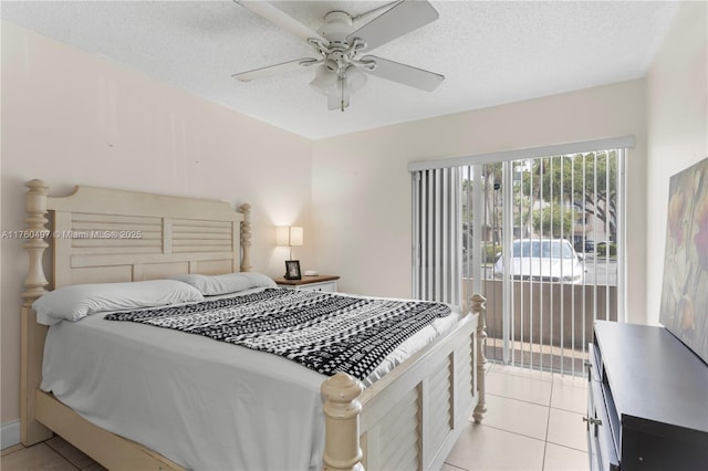 bedroom featuring light tile patterned floors, a textured ceiling, and ceiling fan