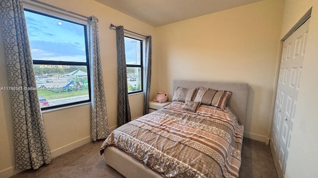 carpeted bedroom with baseboards