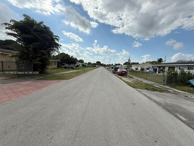 view of street with street lights and sidewalks