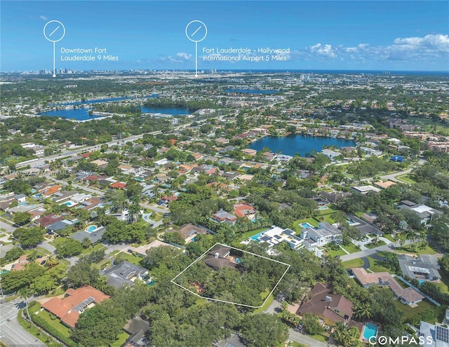 birds eye view of property featuring a residential view and a water view