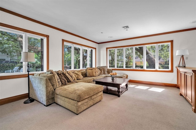 living area featuring ornamental molding, a wealth of natural light, and light carpet