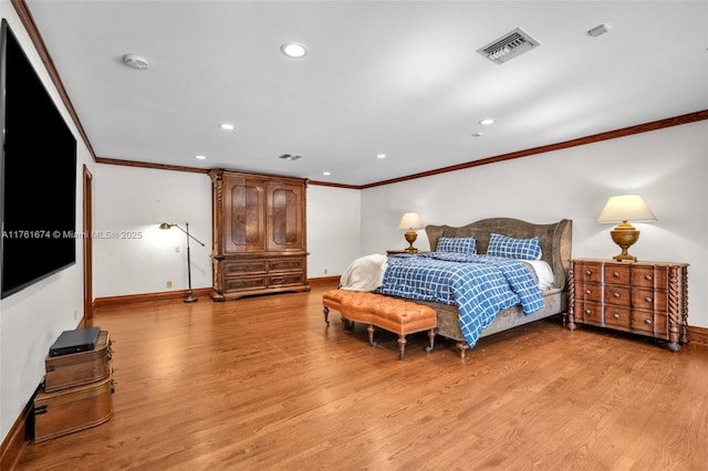 bedroom with crown molding, visible vents, and light wood-type flooring