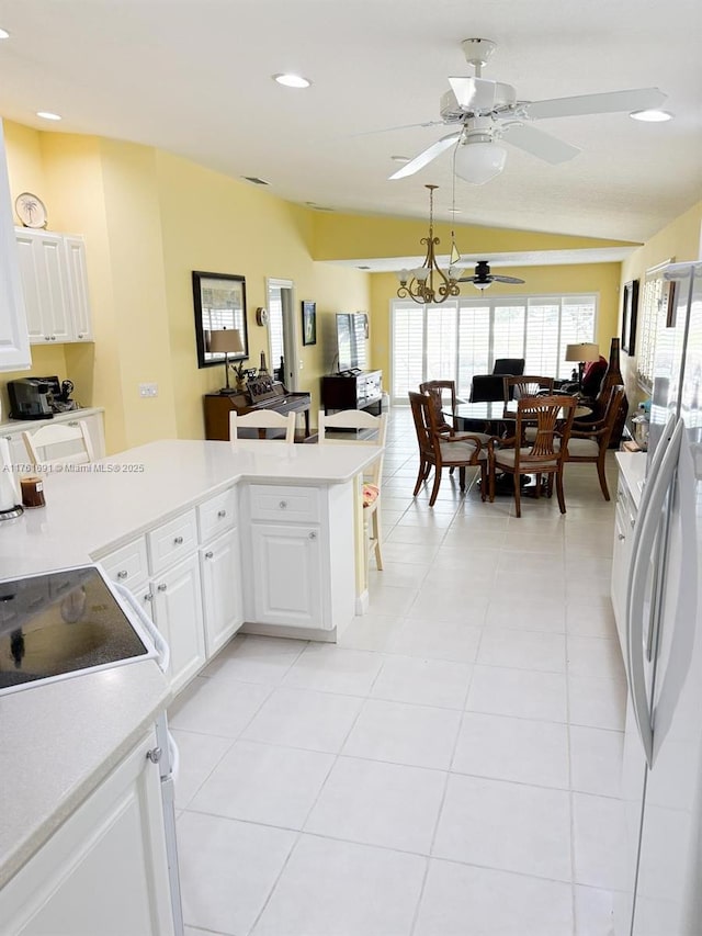 kitchen with light tile patterned flooring, white cabinetry, light countertops, and ceiling fan