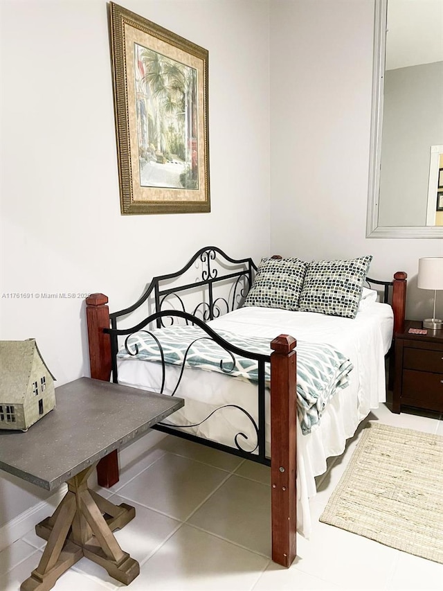 bedroom with tile patterned floors