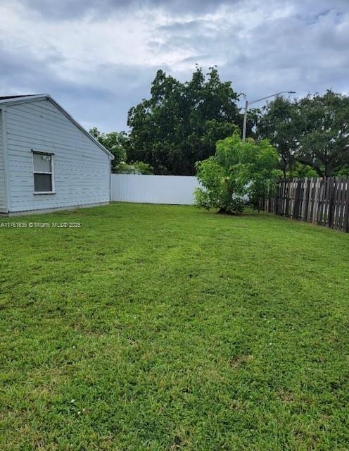 view of yard featuring fence