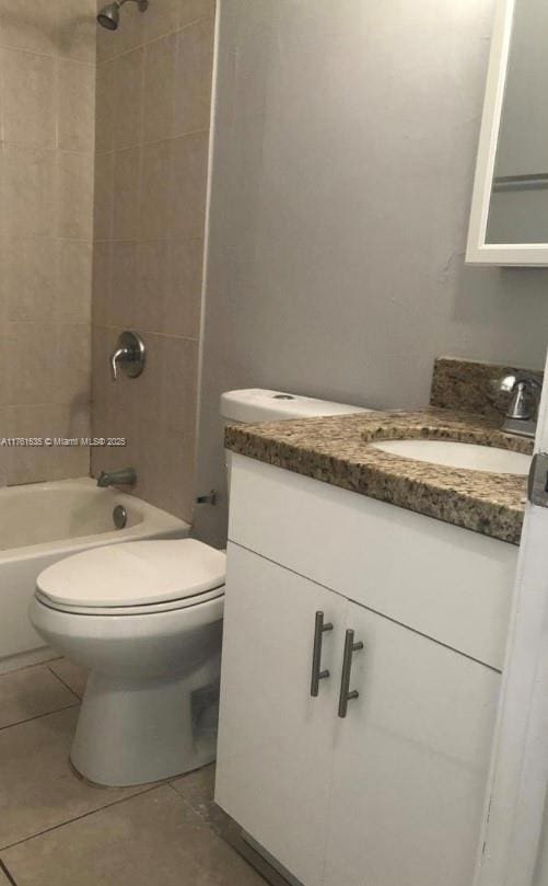 full bathroom with tile patterned flooring, toilet, vanity, and bathtub / shower combination