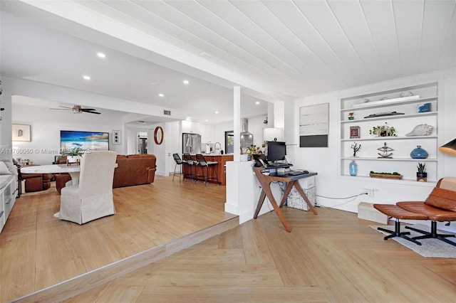 interior space with recessed lighting, built in shelves, and a ceiling fan