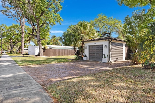 garage featuring fence