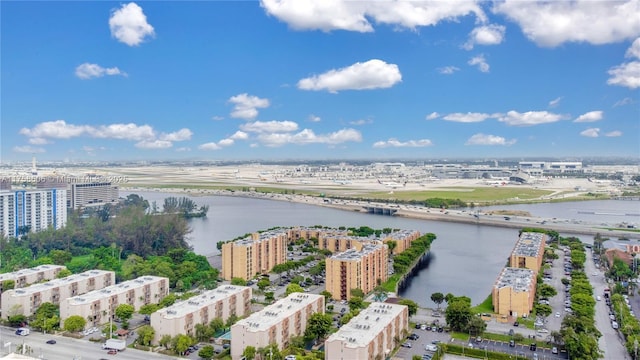 birds eye view of property featuring a city view and a water view