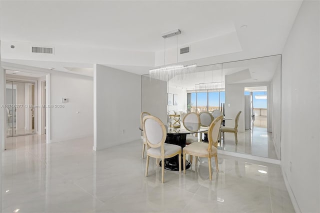 dining room featuring visible vents