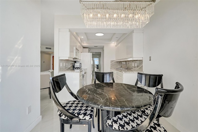 dining space featuring light tile patterned flooring and visible vents