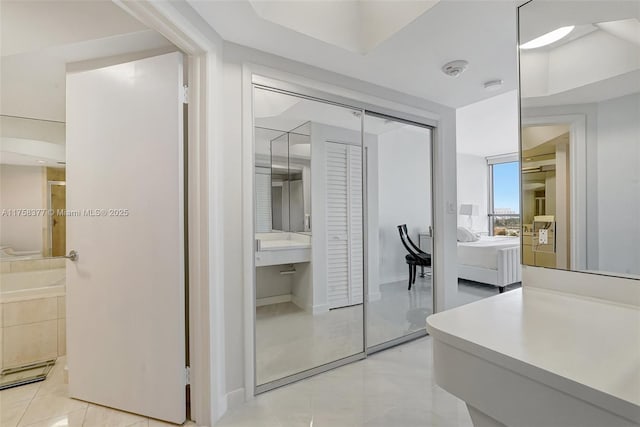 full bathroom featuring vanity, ensuite bath, tile patterned floors, and walk in shower