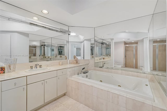 full bath with vanity, tile patterned flooring, a shower stall, a jetted tub, and toilet