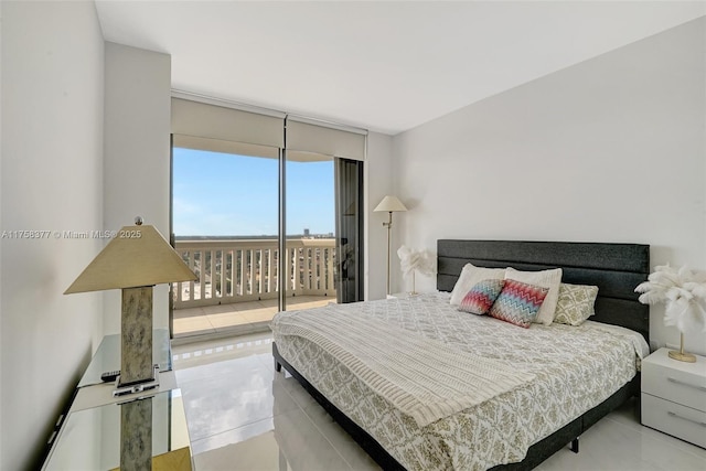 bedroom with access to outside and expansive windows