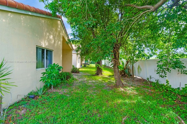 view of yard featuring a fenced backyard