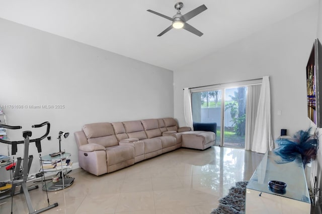 tiled living area featuring a ceiling fan and vaulted ceiling