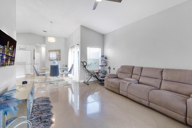 living room featuring a ceiling fan and lofted ceiling