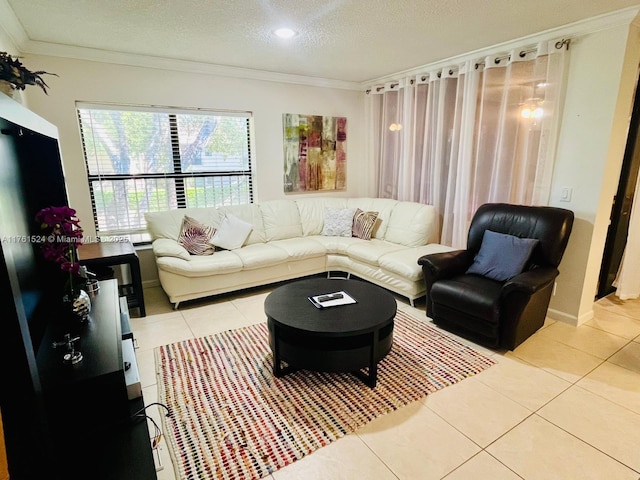 living area with a textured ceiling, light tile patterned floors, baseboards, and ornamental molding