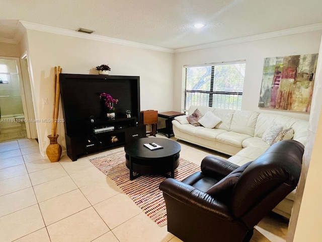 living room featuring light tile patterned flooring, visible vents, a textured ceiling, and crown molding