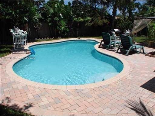 pool with a patio