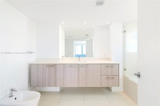 full bath with tile patterned floors, visible vents, a bidet, bath / shower combo with glass door, and vanity