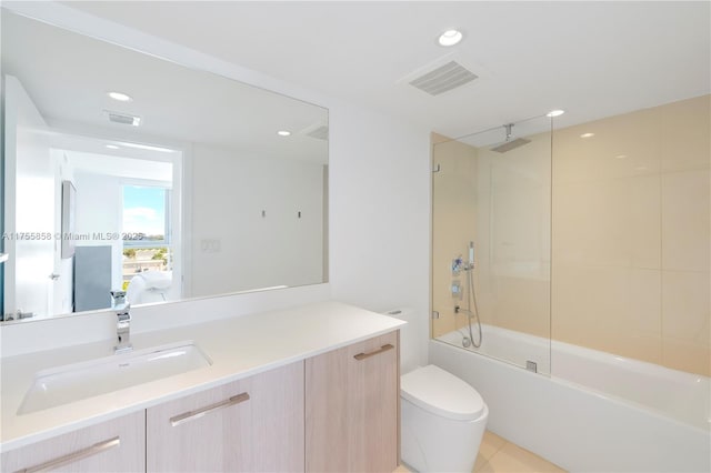 bathroom featuring vanity, toilet, visible vents, and a combined bath / shower with rainfall shower