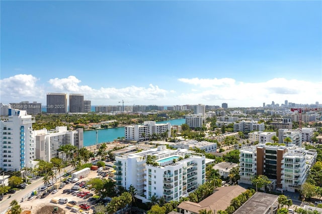 birds eye view of property with a city view and a water view