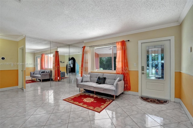 living room with crown molding and a textured ceiling