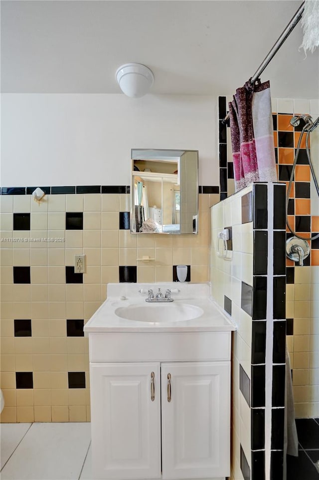 bathroom with curtained shower, tile walls, and vanity