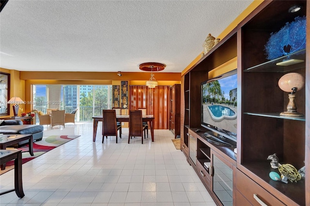 dining space with a textured ceiling