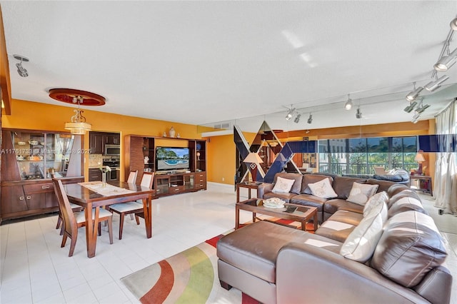 living room featuring visible vents and a textured ceiling