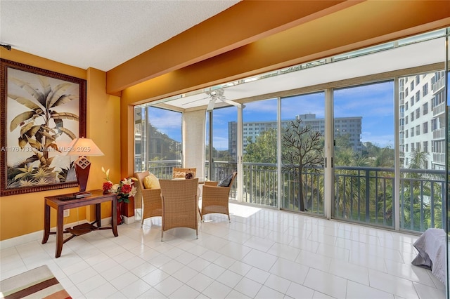 sunroom / solarium featuring a city view