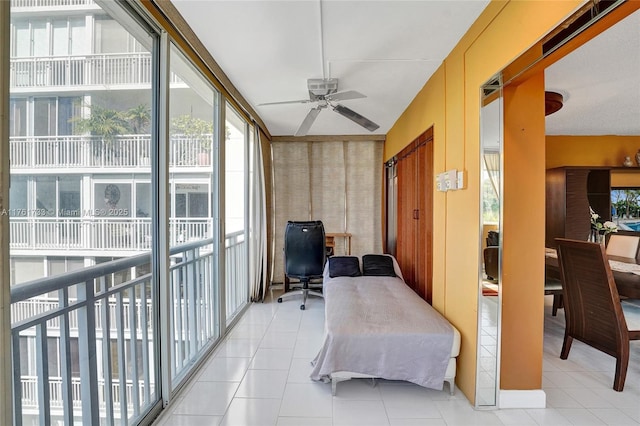 bedroom featuring light tile patterned floors and access to exterior