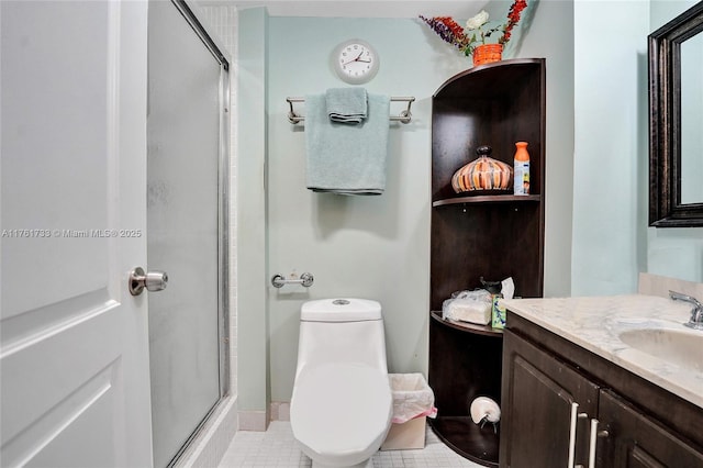 full bath featuring tile patterned floors, a stall shower, toilet, and vanity