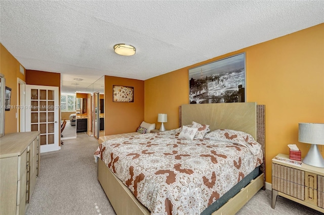 bedroom with light carpet, french doors, and a textured ceiling