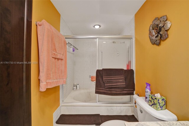 3800 Hillcrest Dr Unit 412, Hollywood, FL 33021 - bathroom featuring toilet and combined bath / shower with glass door
