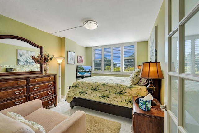 bedroom with light tile patterned flooring