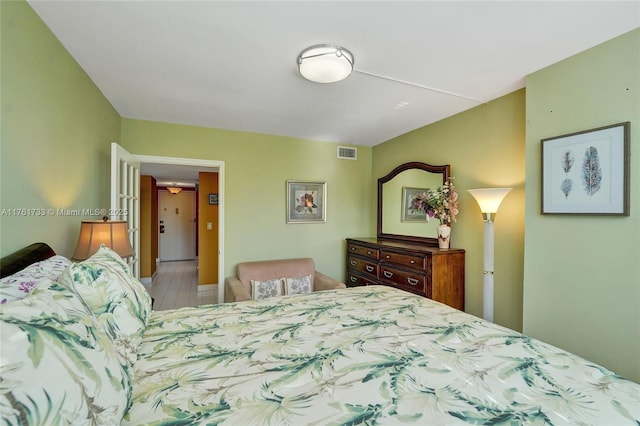 bedroom featuring visible vents