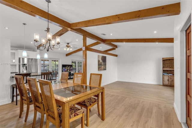 dining area with lofted ceiling with beams, visible vents, baseboards, and light wood-style floors