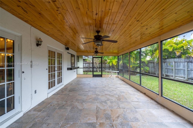 unfurnished sunroom with french doors and wooden ceiling