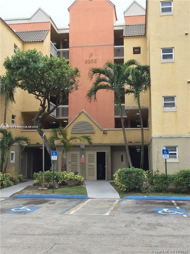 view of property with uncovered parking