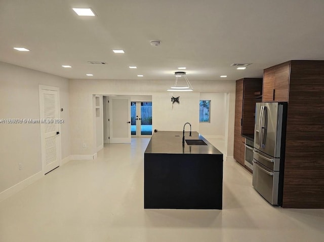 kitchen featuring a sink, stainless steel appliances, modern cabinets, and finished concrete flooring