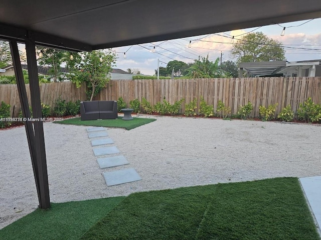 view of yard with a patio area and a fenced backyard