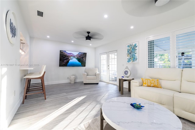 living room featuring recessed lighting, french doors, light wood-style floors, and ceiling fan