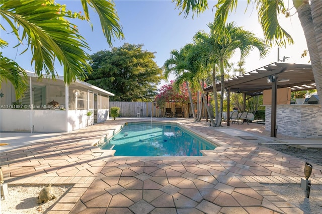 view of pool featuring a fenced in pool, a pergola, a patio, and fence